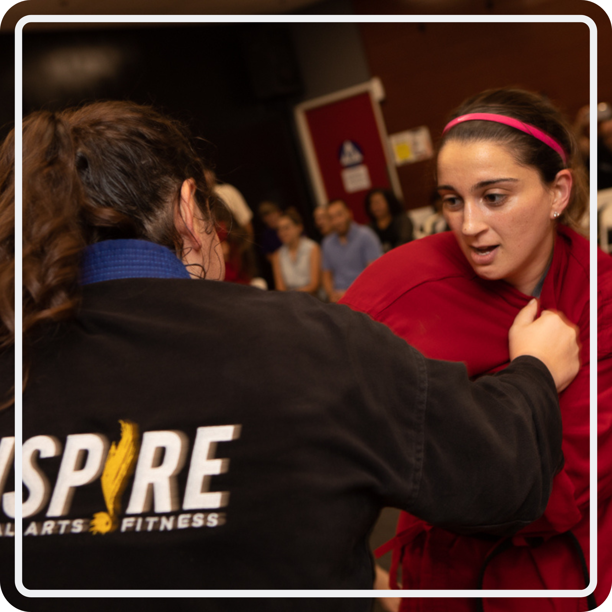 Two Inspire martial artists practicing a close-range self-defense drill